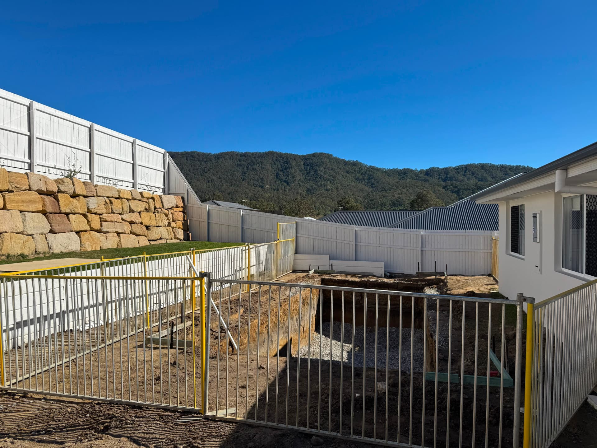 Temporary pool fencing on a sloped Gold Coast site
