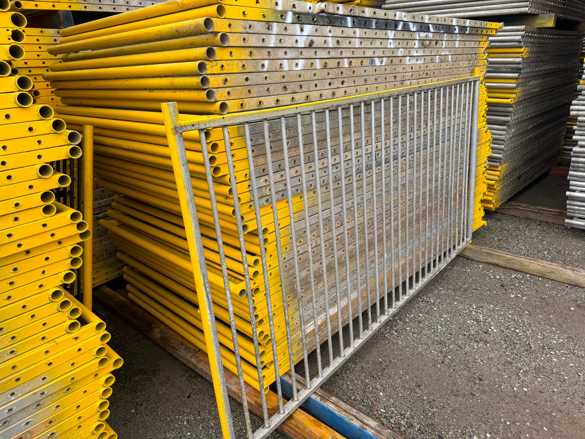 Pool fence panels stacked in the Aus Fence Hire yard