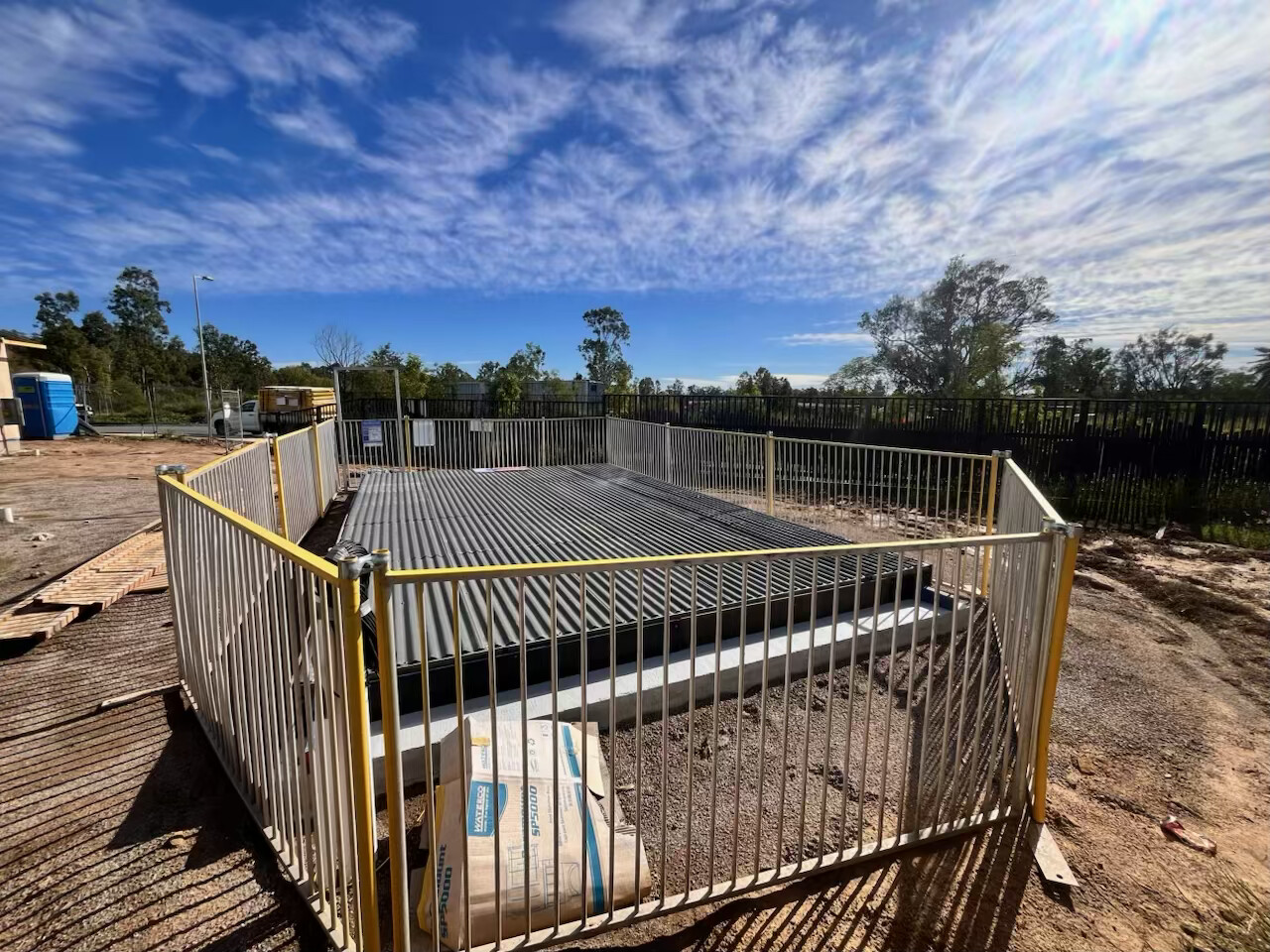 Temporary pool fencing installed around a residential pool build