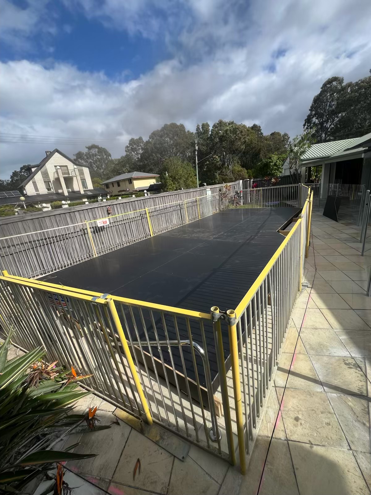 Hard pool platform enclosed by temporary fencing